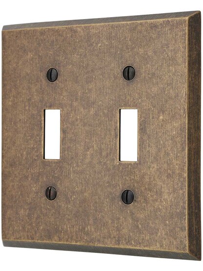 Traditional Forged Brass Double Toggle Switch in Antique Brass.